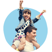 Child celebrating on parents shoulders