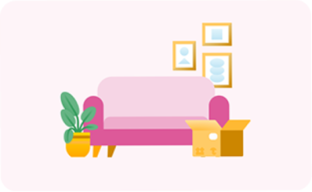 Pink sofa, moving box, plant and picture frames on wall